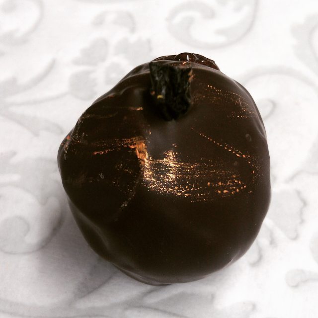 Lil' Blue is a blueberry wine ganache piece in dark and milk chocolates, finished with a dried blueberry