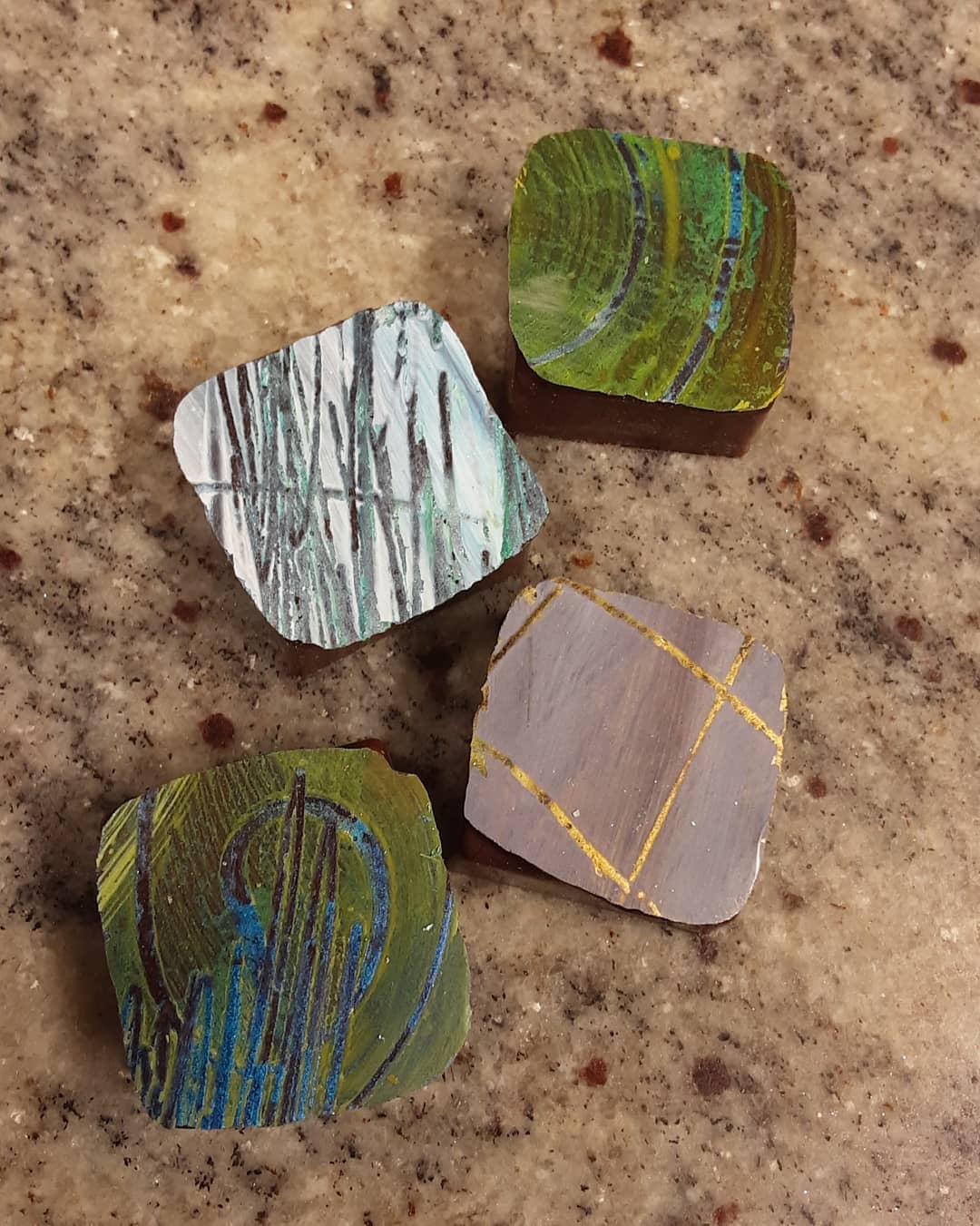 IN ESSENCE, WATERLILIES: Ceylon tea marshmallow in Dominican Republic dark milk chocolate. #chocolatier #chocolateart #waterlilies soft florals float, eyes caught in fragrance, brilliance in light catches ripples.