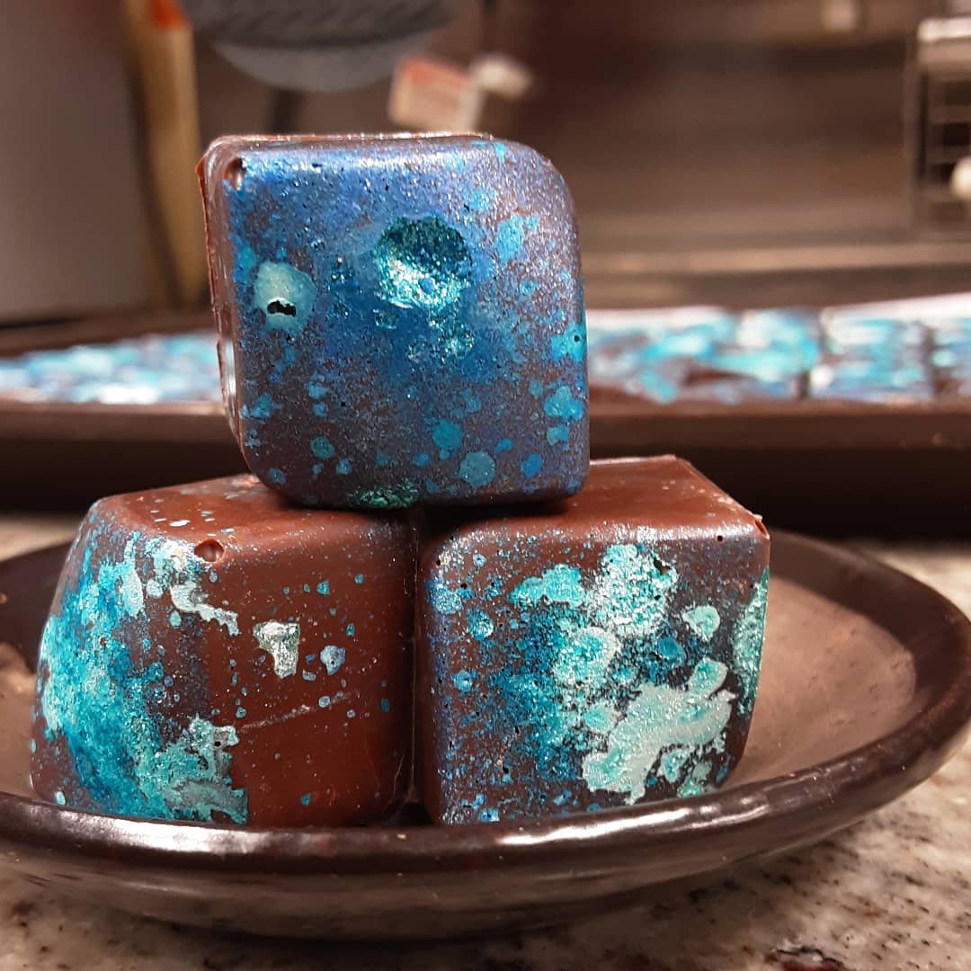 LIKE WATER FOR A PRESENTATION: cinnamon white chocolate caramelized ganache in housemade Mexican milk.#chocolatier #college #beantobonbon Thinking globally, not really an issue. Water drops trickle in mind. Thoughts in spatters, rather everywhere, and presentation is much of it for today.