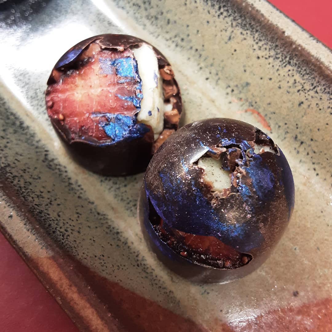 STARS IN MY POCKET - solid cluster of strawberry, cacao nibs, and lemon-infused white chocolate cast in Wild Bolivian Heirloom HCP2 dark. #chocolatier #texture @heirloomcacao #saveheirloomchocolateday @samuel_delanyLike grains of sand scattered across my tongue sparking light against velvet. Say it again Sam.