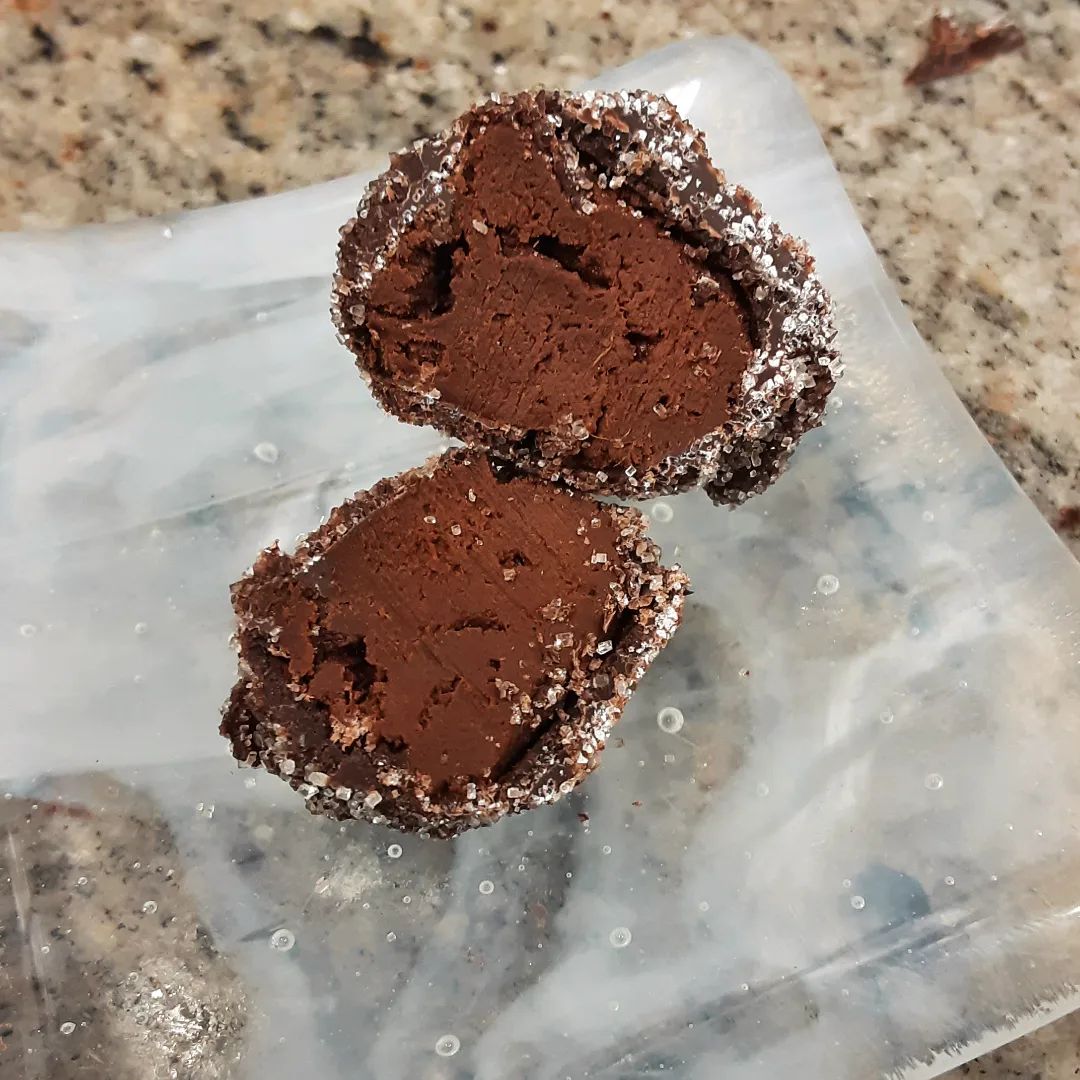 FORMATING FRUITS: fresh, slightly fibrous mango dark chocolate ganache with a crisp sugar shell#chocolatier #chocolatetruffles #mango #freshfruitFresh fruit turned puree exceptionally, puree restructured into a ganache, truffles divided, rolled, enrobed, fruit as fruit until its not.