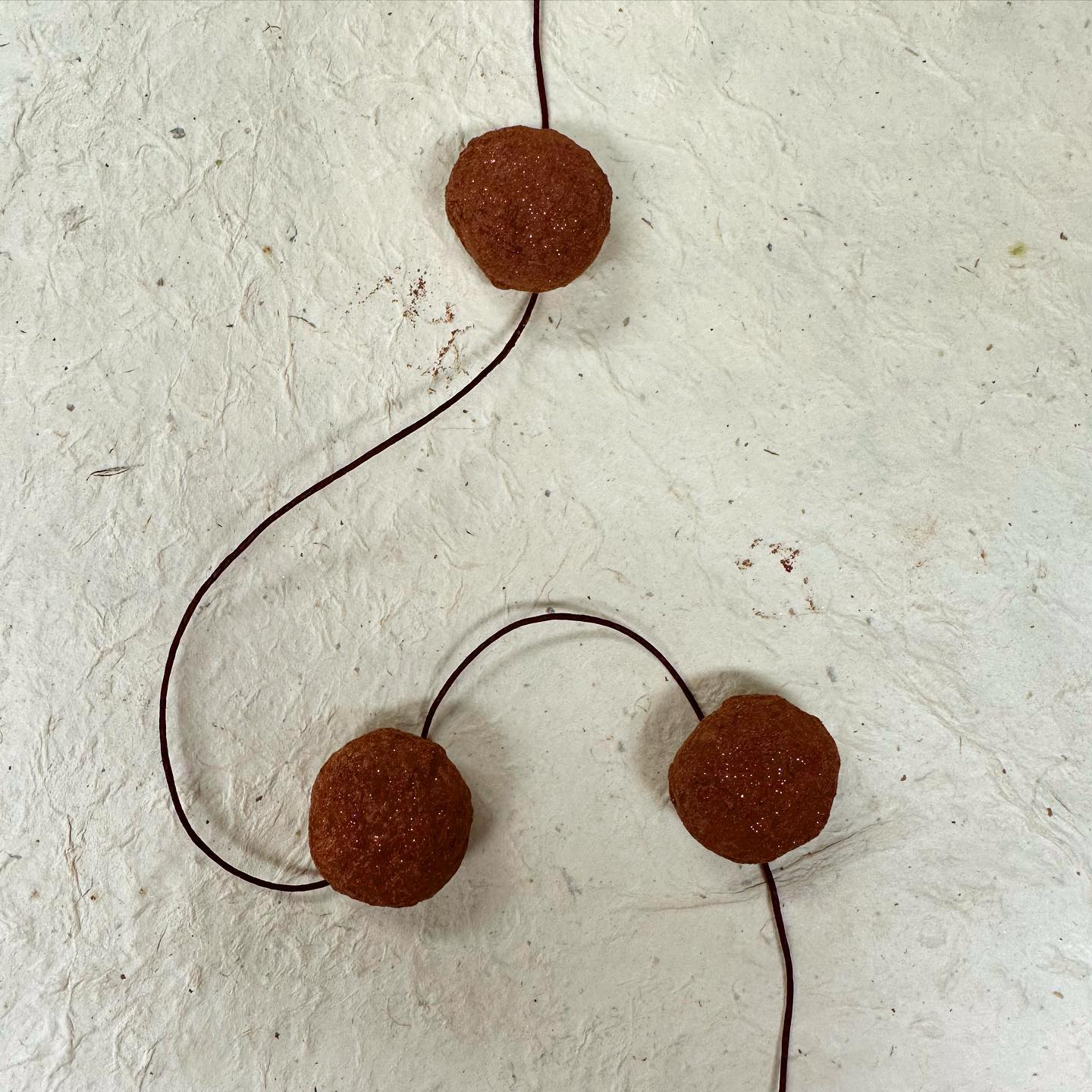 FIELD OF RED ~ Fresh local strawberry in Ecuador 70% dark blend enrobed in Mexico dark milk and dusted in cocoa powder. #chocolatier #beantobonbon #chocolateasart #truffle When I was young I used to walkThrough fields as white as snowLilies clung to my feetAs I frolicked to and fro Then I grew, went to schoolFound a different heart to loveWe’d dance atop the lilies White as a winter doveMemories ebb and flow Waves upon a shore My love was swept away for meA love I have no moreNow I lay in piecesNailed to my wooden bedNo longer do I frolicThe fields have turned to red